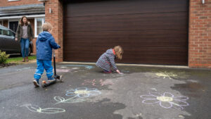 Kids Playing on Driveway in front of garage door