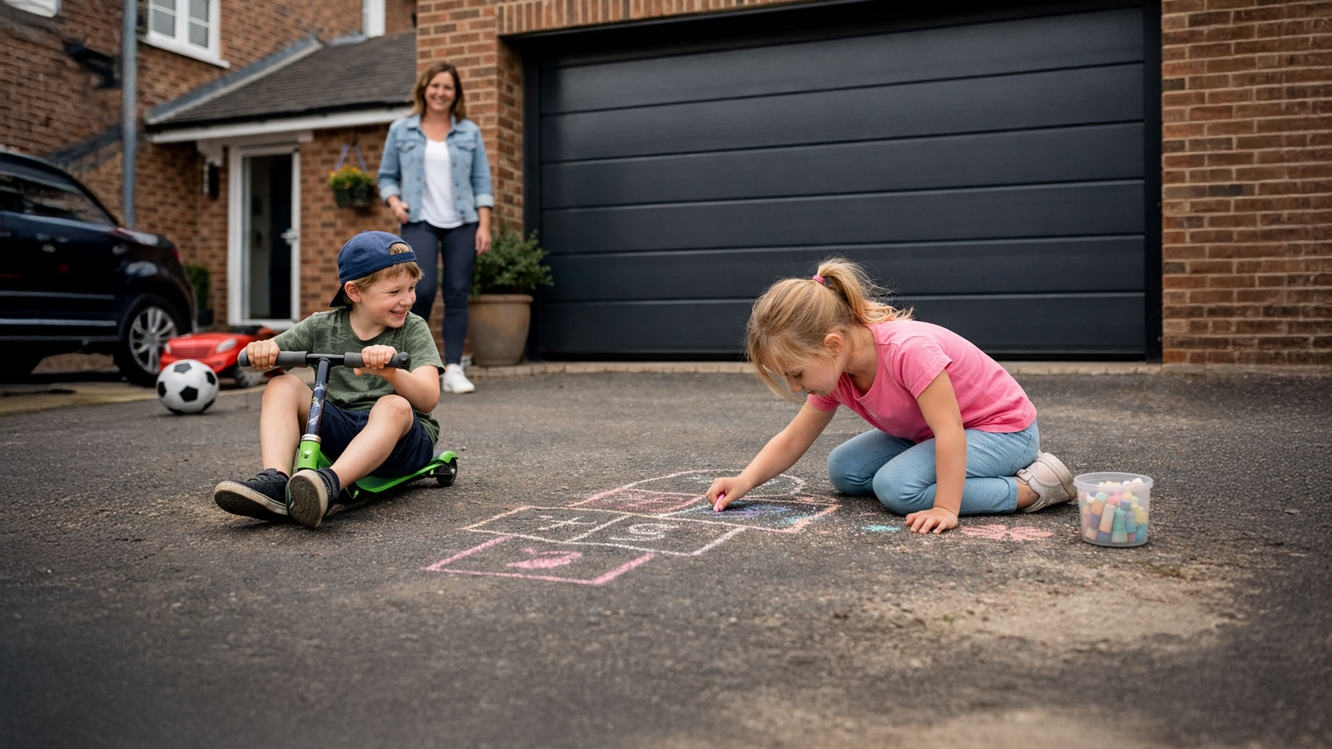 Kids playing on driveway in front of garage door