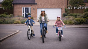 Mother and Children in front of Garage Door on UK Street
