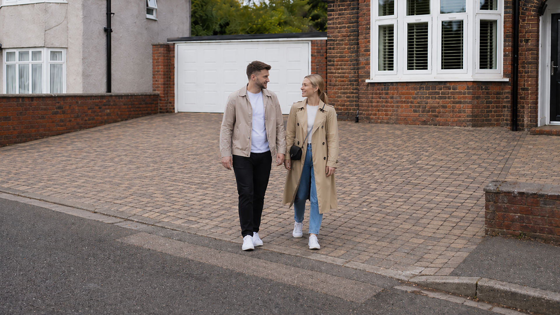 Young Couple with Garage Door
